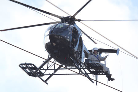 Helicopter performing external load inspection
